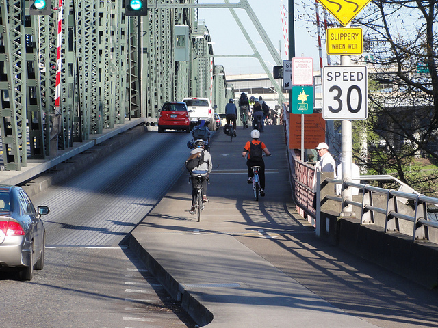 Hawthorne Bridge with new 10.5 foot sidewalks that include markings for one-way bicycle travel and bi-directional pedestrian travel on the right.