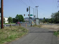 Trail routed to Johnson Creek/Linwood signalized intersection. Trail users cross using crosswalks.