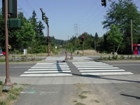 Bicyclist view of the trail crossing at 82nd Avenue and 122nd Avenue.