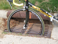 Bicycle tire in a drain grate.