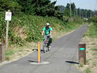 Flat grade with sight lines at the 82nd Avenue and 122nd Avenue crossing.